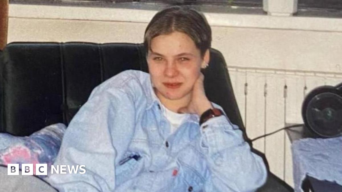 An aerial photo showing a sea of flooded fields in Somerset and in the foreground is a hill with a church on the top