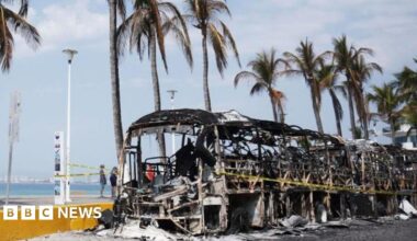 Burned out vehicles on the boardwalk in Puerto Vallarta, Mexico