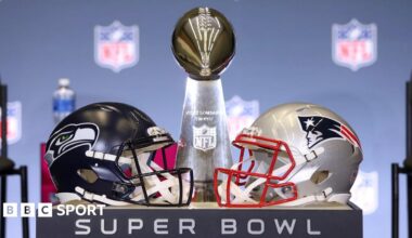 The Lombardi Trophy trophy along with helmets from the New England Patriots and Seattle Seahawks ahead of Super Bowl 60
