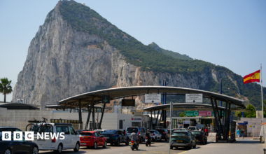 Cars queue at the border between Spain and the Rock of Gibraltar