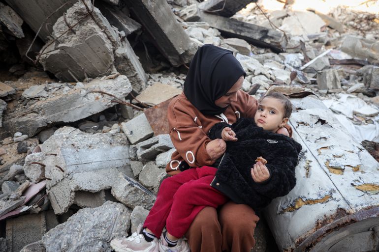 Nebal with her two-year-old daughter, Rita [Abdelhakim Abu Riash/ Al Jazeera] 