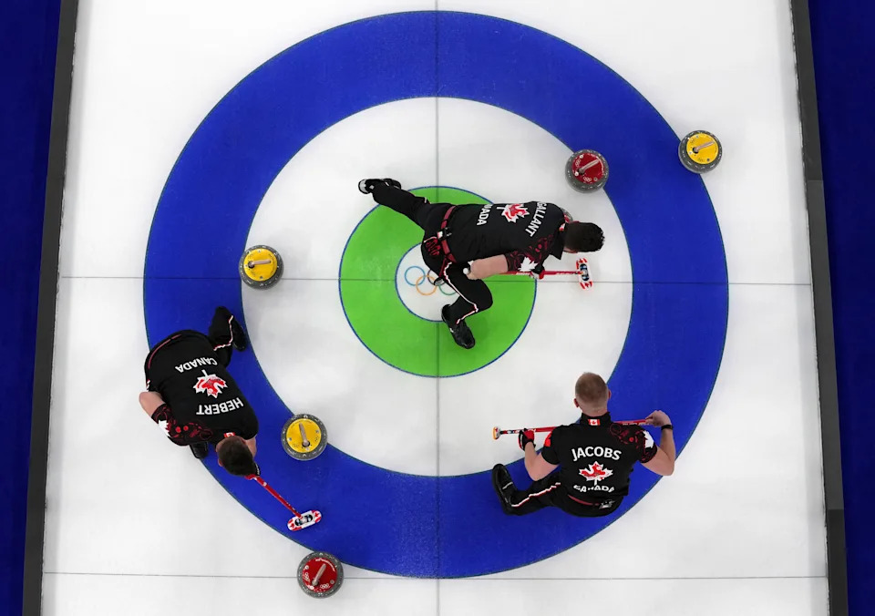 Milano Cortina 2026 Olympics - Curling - Men's Round Robin Session 1 - Canada vs Germany - Cortina Curling Olympic Stadium, Cortina d'Ampezzo, Italy - February 11, 2026. Brett Gallant of Canada, Ben Hebert of Canada and Brad Jacobs of Canada in action during Men's Round Robin Session 1. REUTERS/Issei Kato