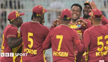 West Indies' Shimron Hetmyer (3R) celebrates with teammates after taking the wicket of Scotland's George Munsey