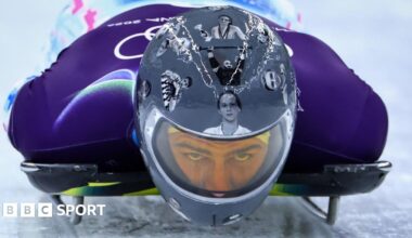 Ukrainian slider Vladyslav Heraskevych wears helmet with images of Ukrainian dead athletes during training run at Cortina sliding Centre, Italy during Winter Olympics