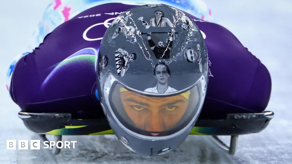 Ukrainian slider Vladyslav Heraskevych wears helmet with images of Ukrainian dead athletes during training run at Cortina sliding Centre, Italy during Winter Olympics