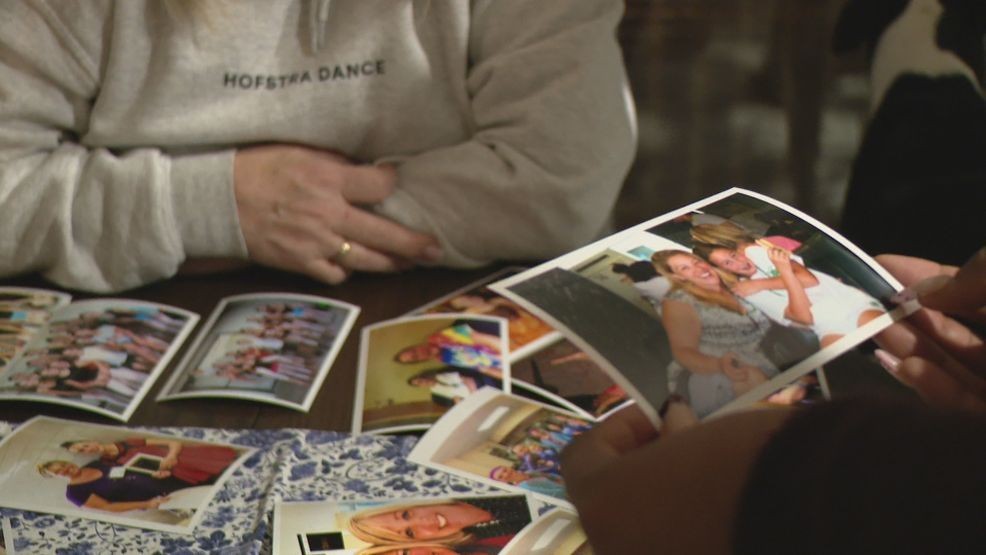 Friends of Rhonda Dorgan looking through photos on Wednesday night, Feb. 18, 2026. (WJAR)