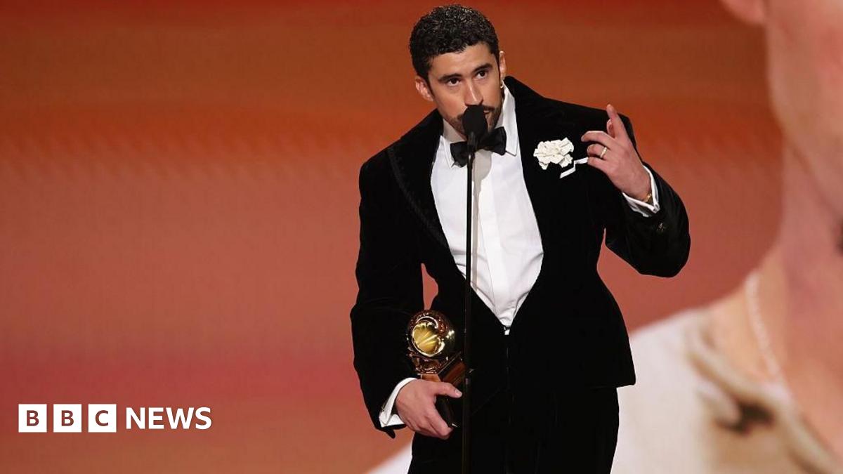 Kehlani holds the Grammys for Best R&B Performance and Best R&B Song at the show