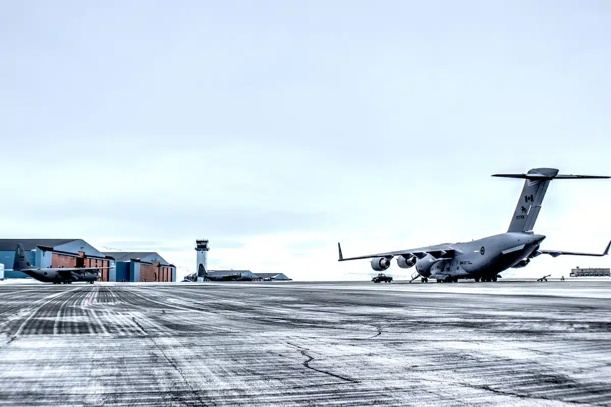 A Royal Canadian Air Force C 17 Globemaster Iii And Two C 130j Super Hercules Aircraft