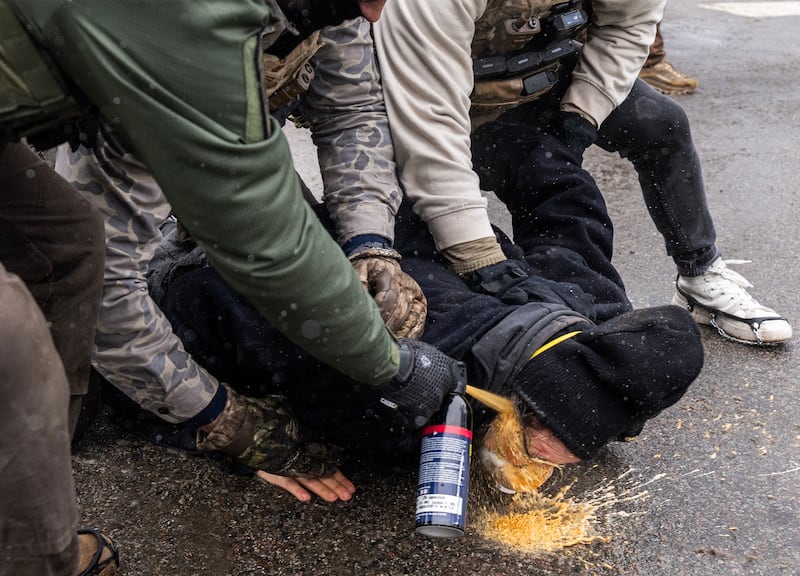 A protester was pinned to the ground by federal agents and a chemical irritant was sprayed directly into his face, Wednesday, January 21, 2026, in south Minneapolis.