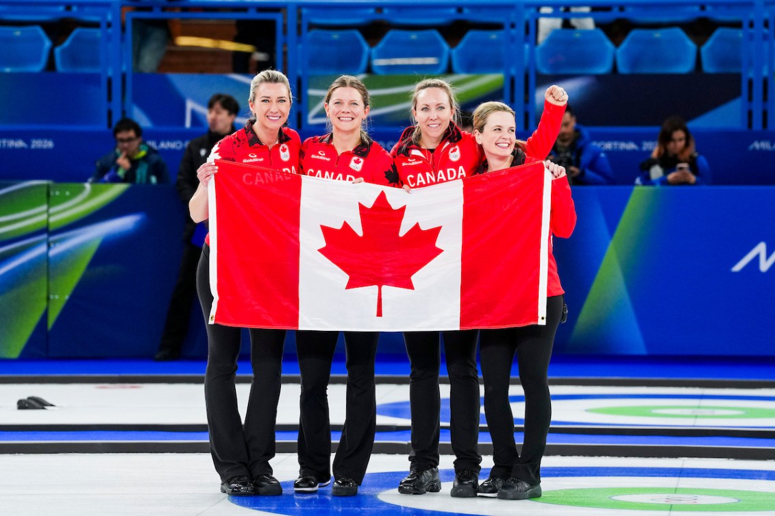 Rachel Homan and team celebrate their bronze medal