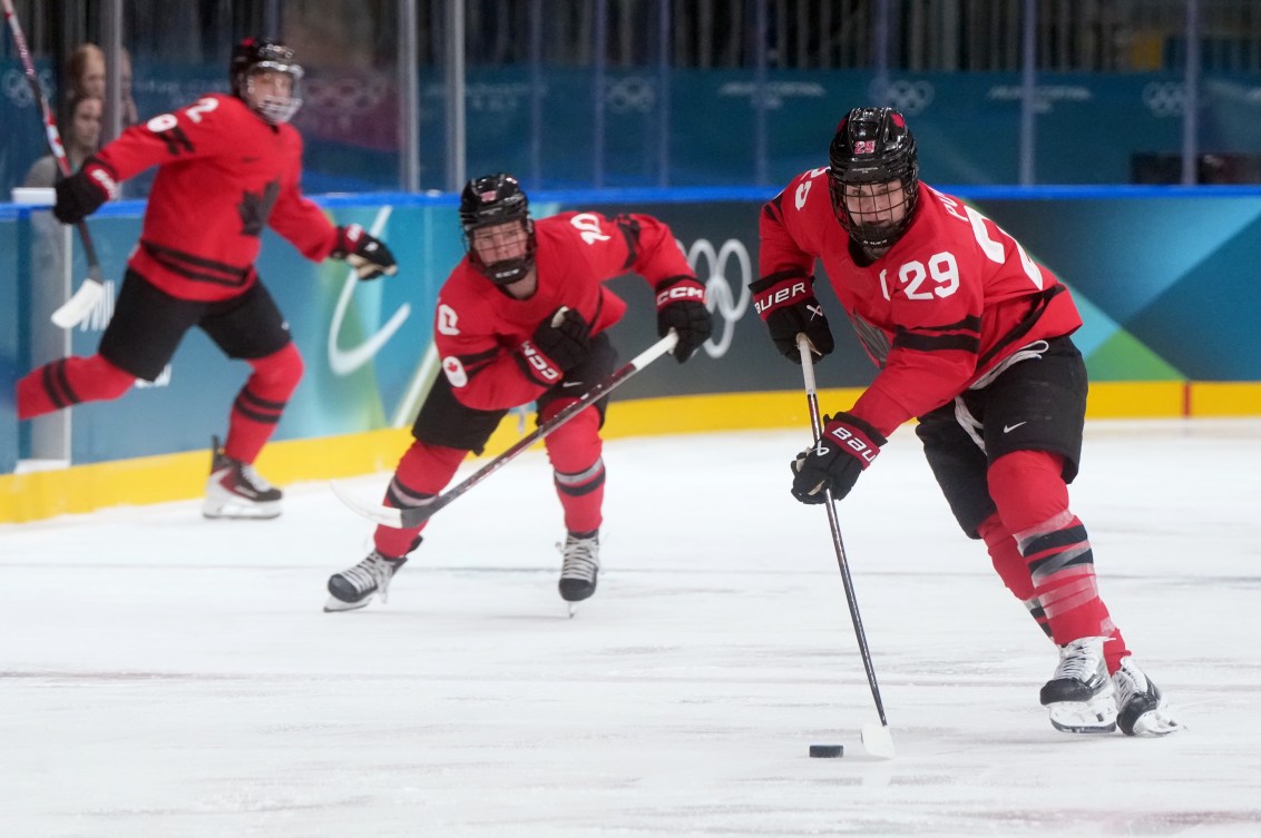 Marie-Philip Poulin (29) moves the puck up the ice