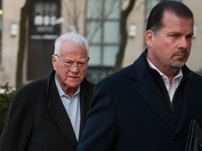 Frank Stronach, left, arrives at the 361 University Ave. courthouse in Toronto, on Tuesday, February 17, 2026.