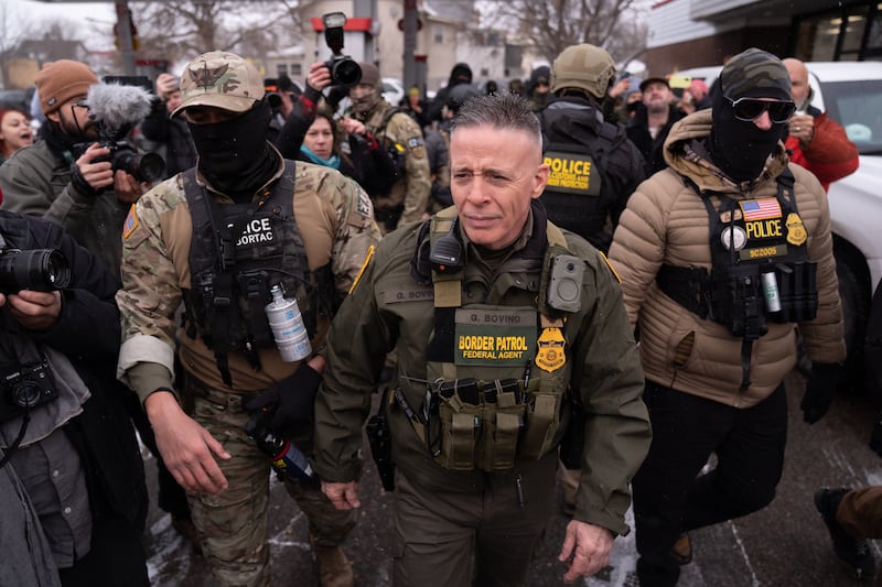 Customs and Border Protection (CBP) Commissioner Gregory Bovino with his security team while a group of citizens opposed to the country's immigration policies protested him in Minnesota on January 21, 2026.