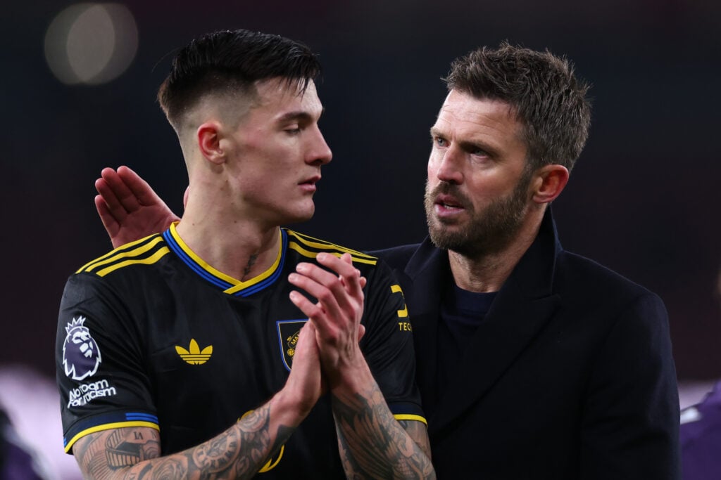 Manchester United head coach Michael Carrick celebrates with Benjamin Sesko after the Premier League match between Arsenal and Manchester United at the Emirates Stadium in 2026 in London, England.
