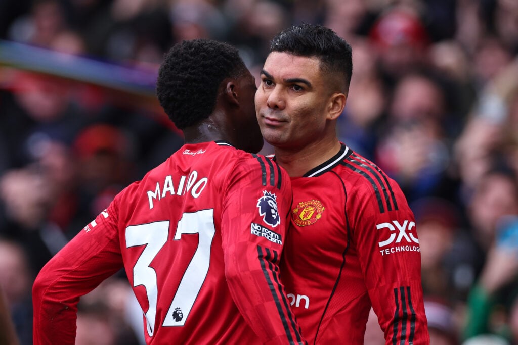 Casemiro and Kobbie Mainoo embrace after Manchester United goal.
