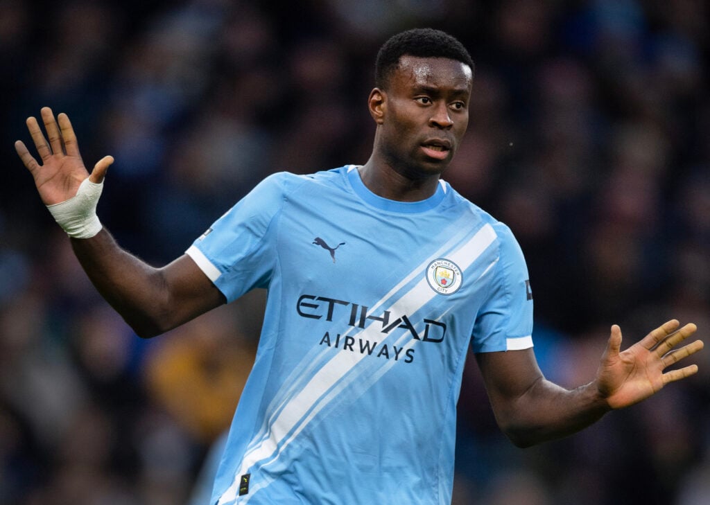 Marc Guehi spreads his arms during Manchester City's Premier League match against Wolverhampton Wanderers at the Etihad Stadium