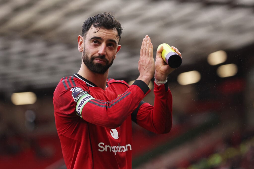 Bruno Fernandes applauds the fans as he celebrates victory during the Premier League match between Manchester United and Tottenham Hotspur at Old Trafford in 2026 in Manchester, England.