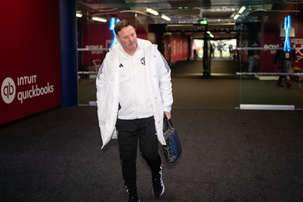 Steve Holland arriving at West Ham in a Manchester United tracksuit