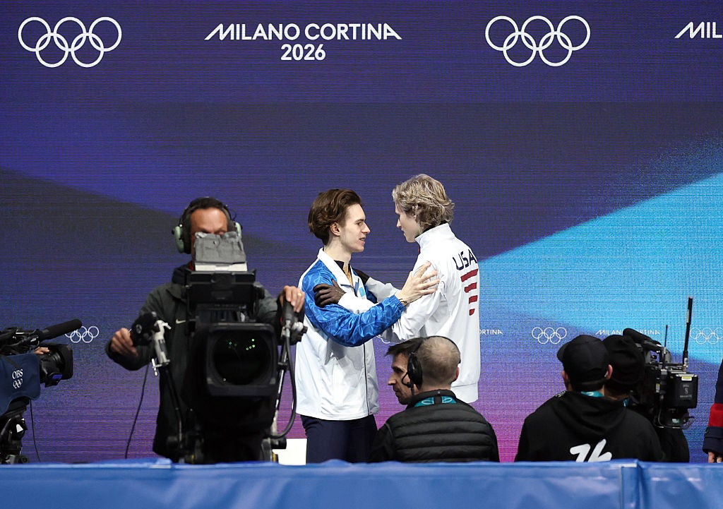 Malinin recovered him composure to congratulate gold medallist Shaidorov