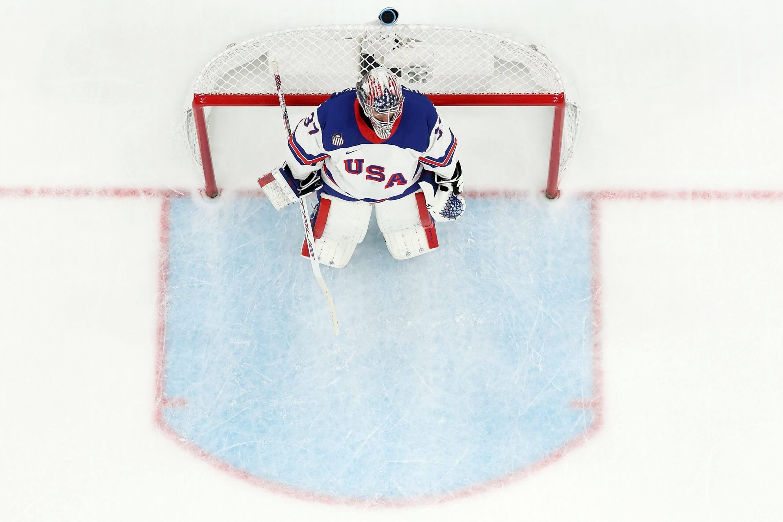 U.S. goaltender Connor Hellebuyck stands in the blue-painted crease area in front of the goal as the Americans faced Slovakia in an Olympic men's hockey semifinal at the 2026 Winter Olympics.