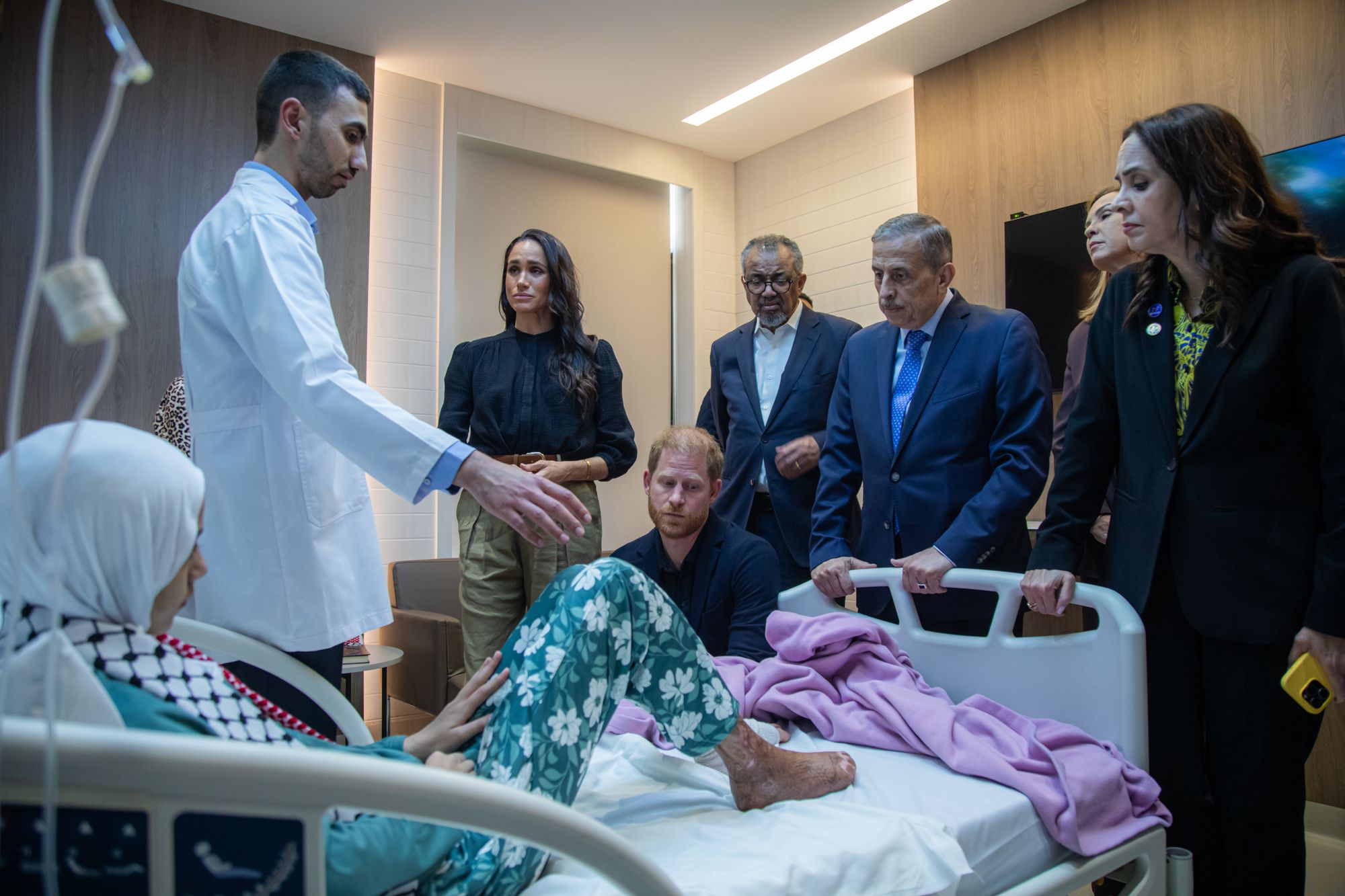 Meghan Markle and Prince Harry at the bedside of Maria, a 14-year-old burns victim, at the Speciality Hospital in Amman this week