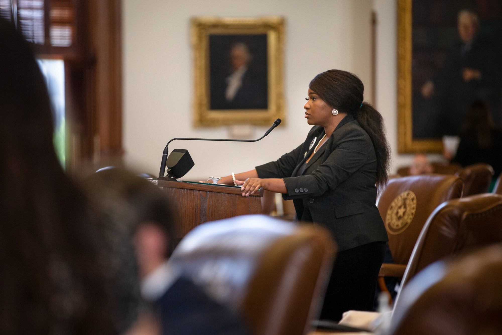State Rep. Jasmine Crockett, D-Dallas, waits to ask a question on the House floor at the Texas Capitol on May 25.