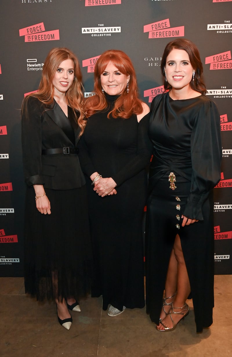 Sarah Ferguson with her daughters, Princess Beatrice and Princess Eugenie—reports suggest the princesses have sought to distance themselves from their father, Andrew, amid the Epstein files revelations.