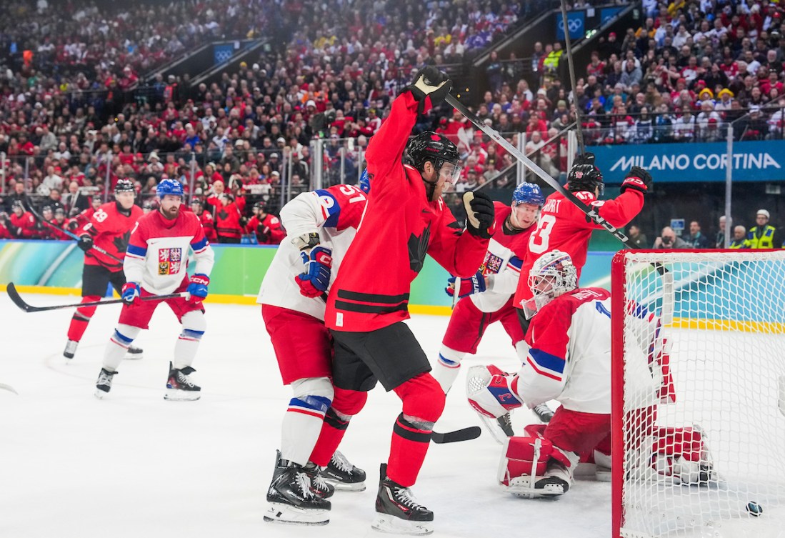 Connor McDavid celebrates a goal by teammate Nathan MacKinnon