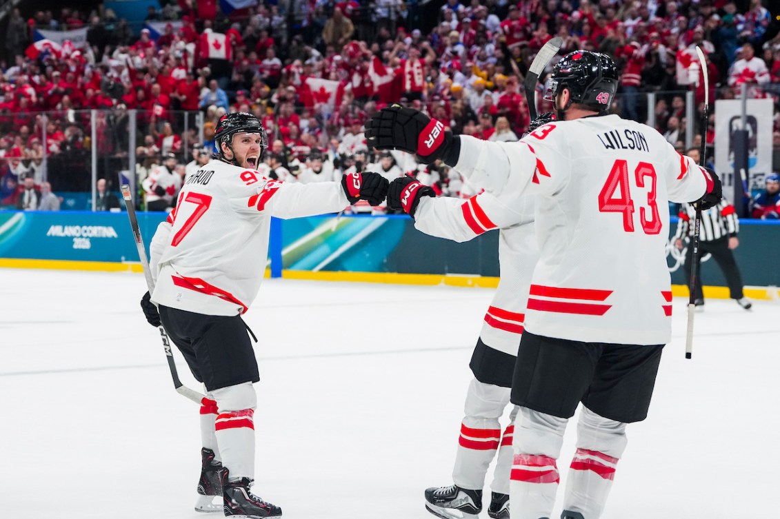 Team Canada’s Macklin Celebrini celebrates a goal with teammates Connor McDavid and Tom Wilson during the first period of men’s preliminary round hockey against Czechia at the Milano Cortina 2026 Olympic Winter Games.
