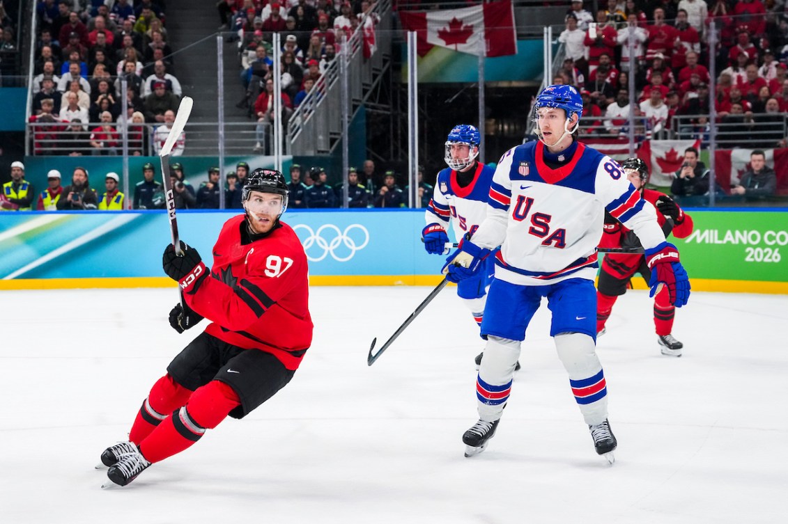 Connor McDavid skates against Jake Sanderson