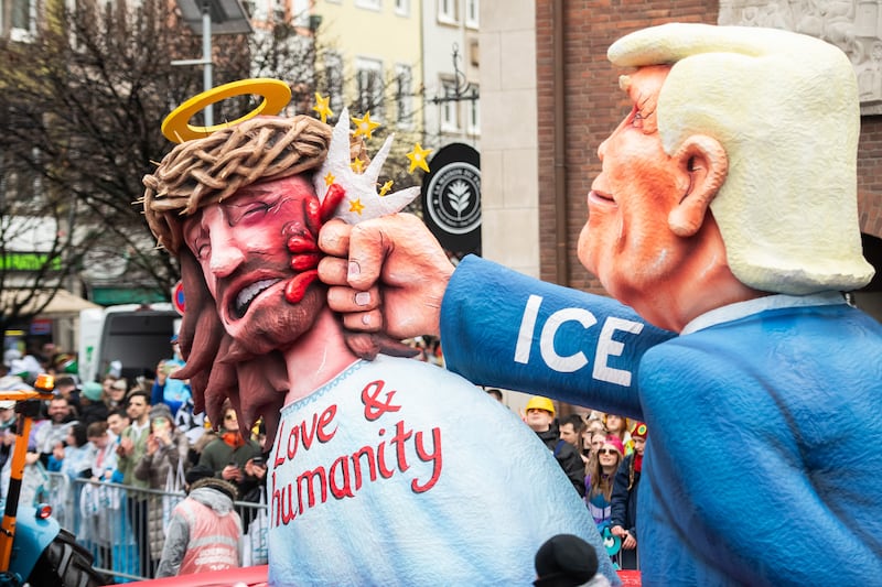 DUESSELDORF, GERMANY - FEBRUARY 16: A carnival float mocks American President Donald Trump during the annual Rose Monday parade on February 16, 2026 in Dussledorf, Germany. Rose Monday is the highlight of Carnival season, especially in western Germany, where parade float designers are famous for often searing and irreverent depictions of German and foreign politicians. (Photo by Hesham Elsherif/Getty Images)
