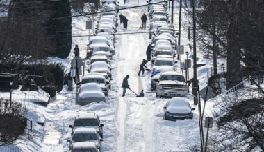 Residents shovel snow and dig out cars buried along a neighborhood street in Haverford Township, Pa. last month.