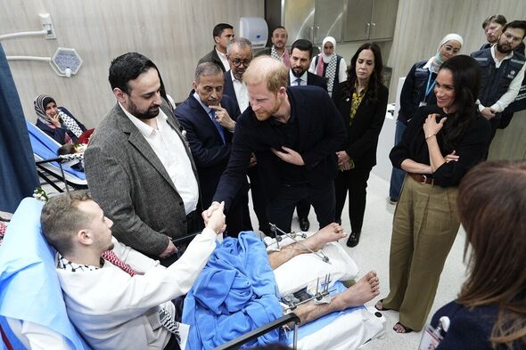 Prince Harry and Meghan Markle meet medical evacuees during a visit to the Specialty Hospital