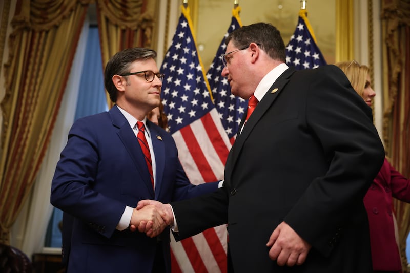WASHINGTON, DC - APRIL 02: U.S. Speaker of the House Rep. Mike Johnson (R-LA) (L) shakes hands with Rep. Randy Fine (R-FL) (R) after participating in a ceremonial swearing-in at the U.S. Capitol on April 02, 2025 in Washington, DC. The swearing-in comes after Johnson sent the House home until the following Monday after trying to block a vote on Rep. Anna Paulina Luna's (R-FL)  proposal for proxy voting for new parents failed. (Photo by Kayla Bartkowski/Getty Images)