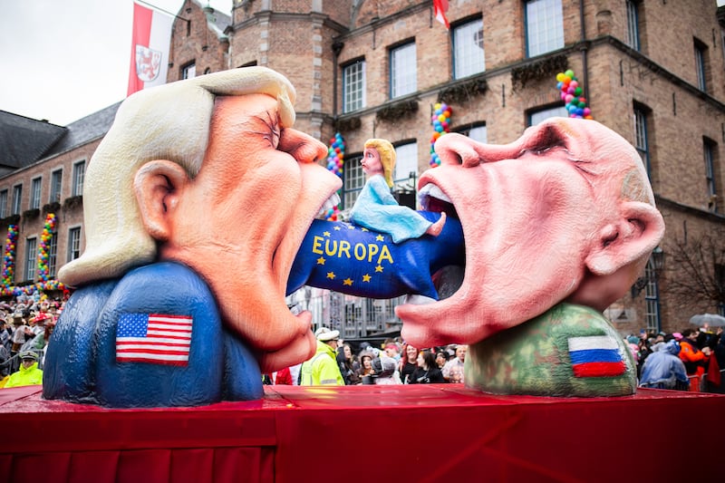 DUESSELDORF, GERMANY - FEBRUARY 16: A carnival float mocks American President Donald Trump and Russian President Vladimir Putin during the annual Rose Monday parade on February 16, 2026 in Dussledorf, Germany. Rose Monday is the highlight of Carnival season, especially in western Germany, where parade float designers are famous for often searing and irreverent depictions of German and foreign politicians. (Photo by Hesham Elsherif/Getty Images)