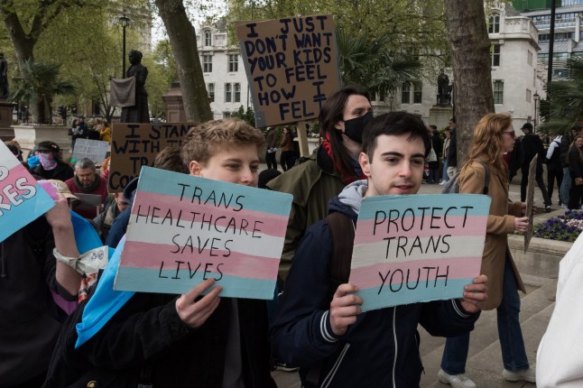 Transgender people and their supporters gather in Parliament Square ahead of a march through central London to protest against a ban on puberty blockers in London, United Kingdom on April 20, 2024. (Photo credit should read Wiktor Szymanowicz/Future Publishing via Getty Images)