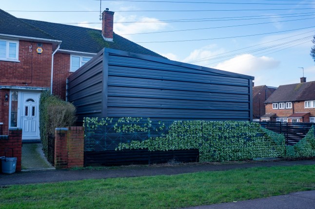 A view of the big wall surrounding his home