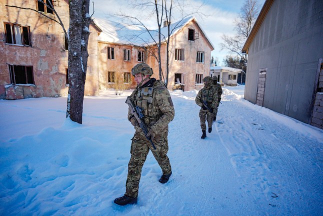 British soldiers from Duke of Lancaster's Regiment patrol through snow, to train for fighting in built up areas on the Tapa range in Estonia, where they are taking part in Exercise Winter Camp, which is part of Operation Cabrit, the UK's contribution to Nato's Forward Land Forces in Estonia and Poland. Picture date: Monday February 2, 2026. PA Photo. Photo credit should read: Ben Birchall/PA Wire