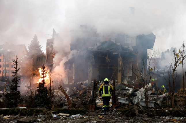Firefighters work at the site of a residential building damaged during Russian drone and missile strikes, amid Russia's attack on Ukraine, in Kyiv, Ukraine, February 22, 2026. REUTERS/Valentyn Ogirenko TPX IMAGES OF THE DAY