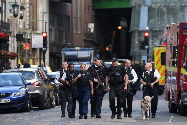 Armed police officers patrol the streets from Borough Market towards The Shard in London on June 4, 2017, following a terror attack. Forty-eight people have been taken to hospital after a terror attack in central London in which six people died, the London Ambulance Service said Sunday. / AFP PHOTO / Chris J Ratcliffe (Photo credit should read CHRIS J RATCLIFFE/AFP via Getty Images)
