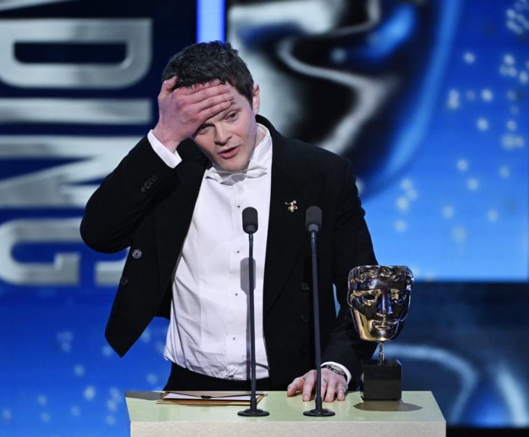 LONDON, ENGLAND - FEBRUARY 22: Robert Aramayo accepts the Leading Actor Award for 'I Swear' on stage during the EE BAFTA Film Awards 2026 at The Royal Festival Hall on February 22, 2026 in London, England. (Photo by Stuart Wilson/BAFTA/Getty Images for BAFTA)
