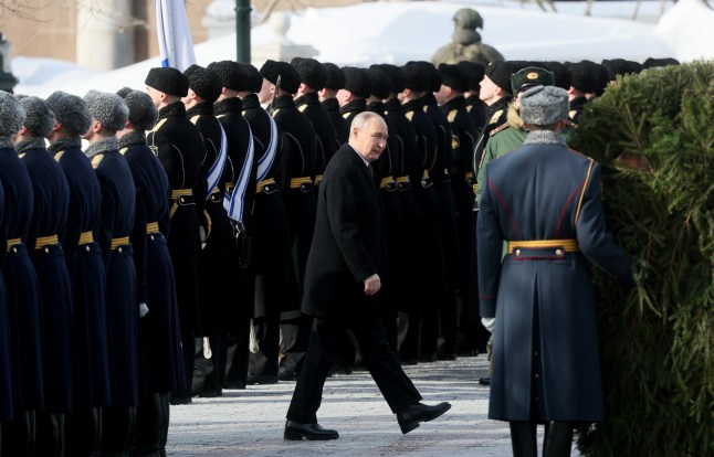 epa12770998 Russian President Vladimir Putin (C) attends a wreath-laying ceremony at the Tomb of the Unknown Soldier, near the Kremlin Wall, during the national celebrations of the 'Defender of the Fatherland Day' in Moscow, Russia, 23 February 2026. Defender of the Fatherland Day is celebrated annually on 23 February in Russia, Belarus, Kyrgyzstan, and Tajikistan, marking the date in 1918 when the first mass draft into the Red Army took place in Moscow and Petrograd during the country's Civil War and war against the German Emperor. EPA/MAXIM SHIPENKOV / POOL