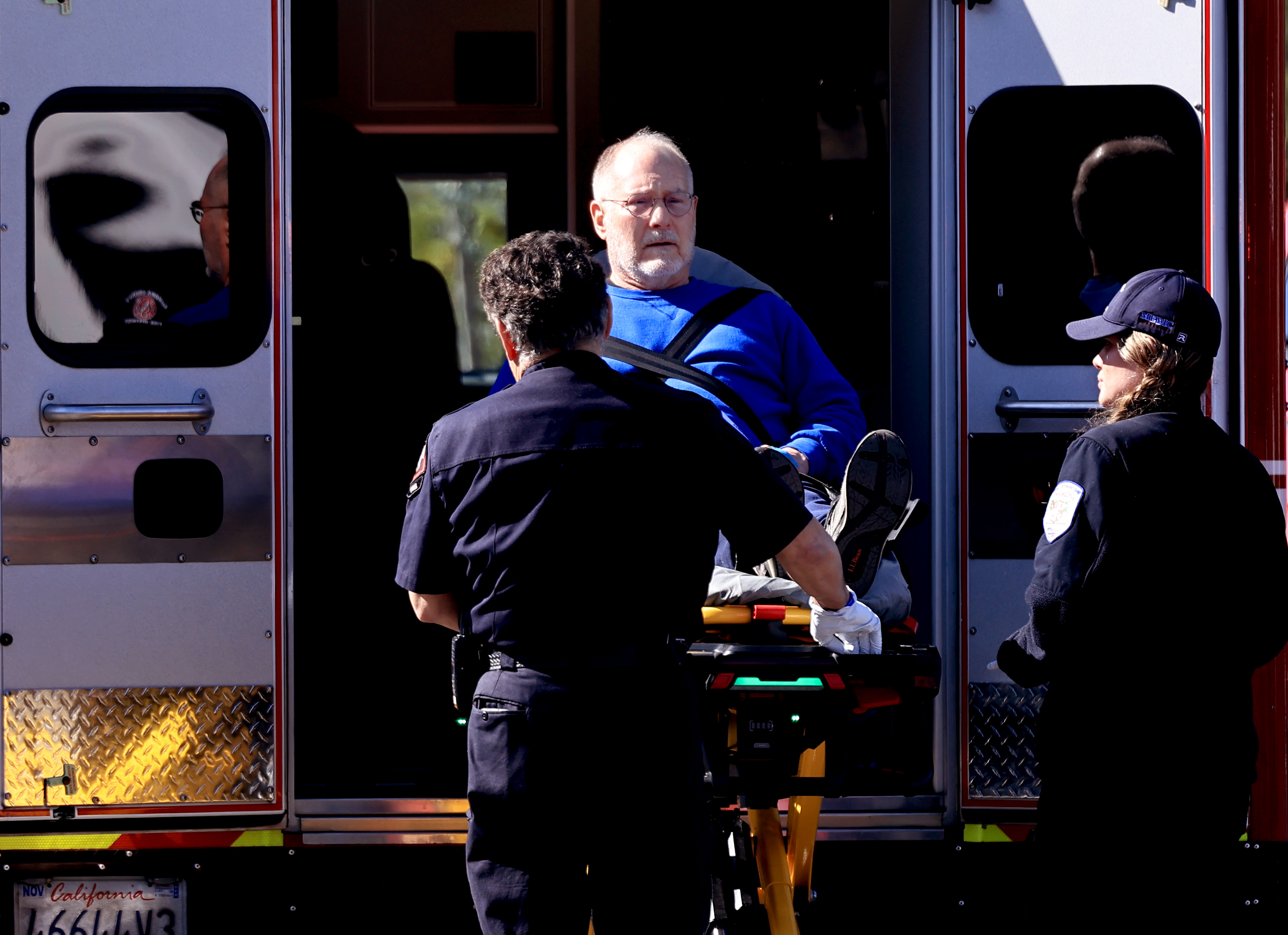 An injured man is wheeled to an ambulance at Oliverâs...
