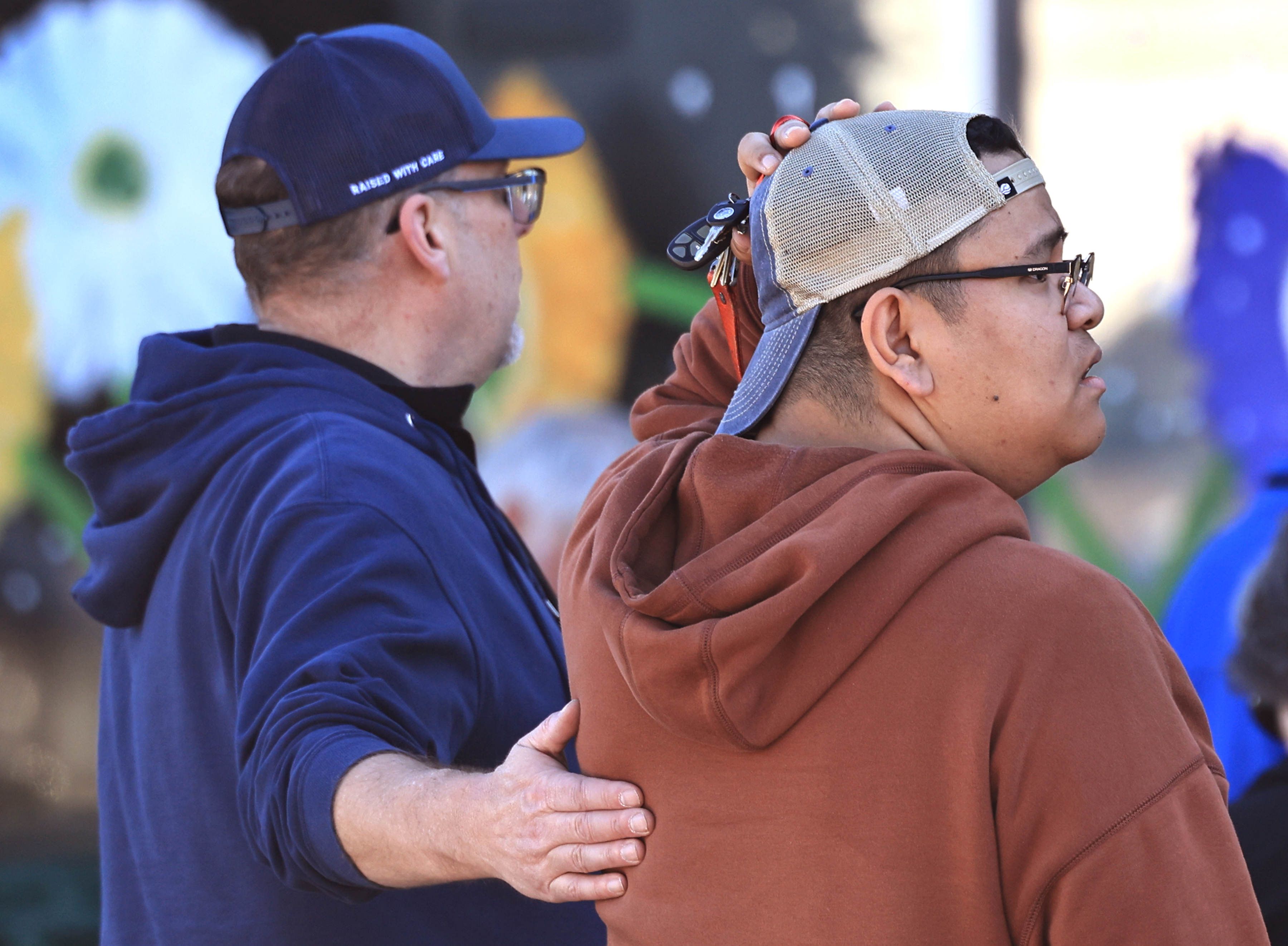 Oliverâs Market employees comfort one another after a vehicle crashed...