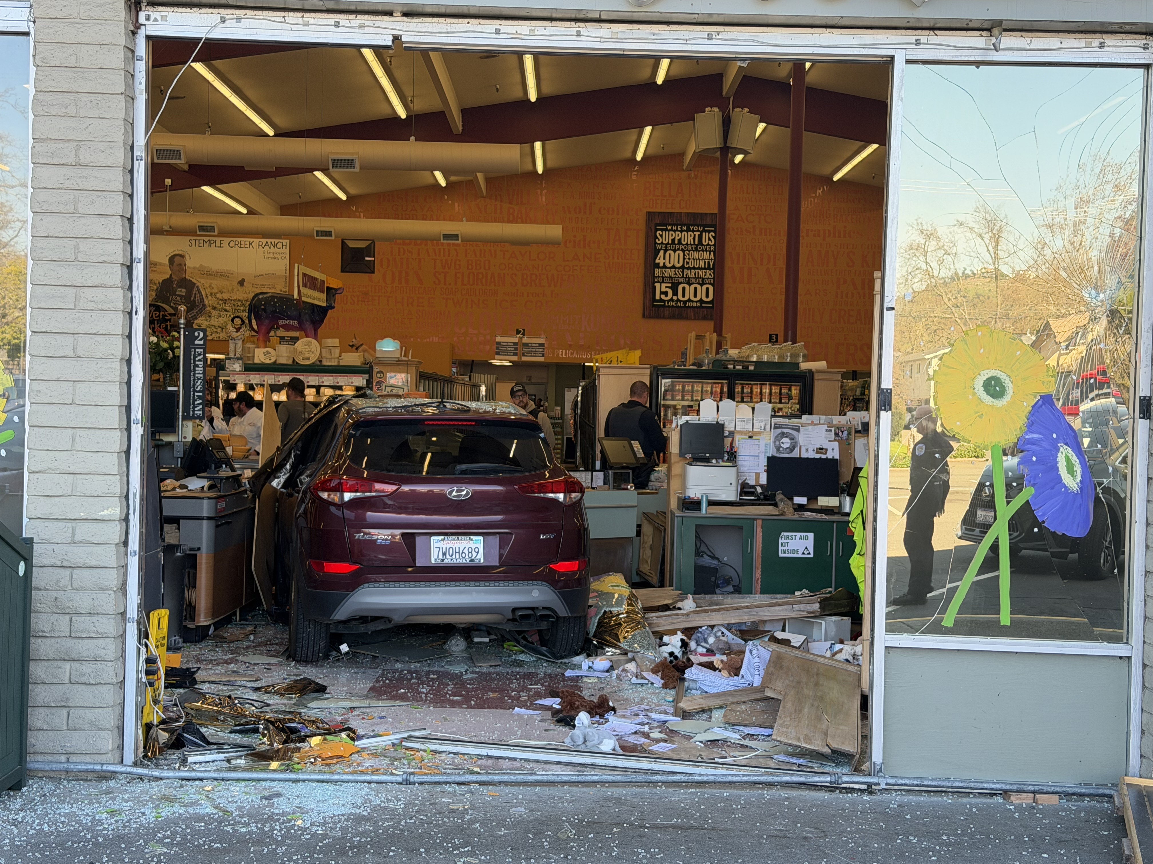 A vehicle drove through the front of Oliver's Market on...