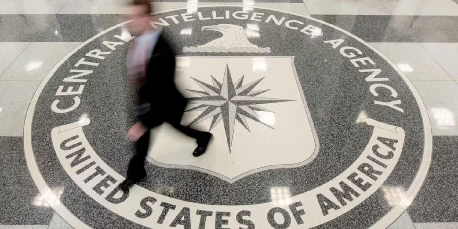 Tim Cook 'slept with one eye open' after classified CIA briefing on Taiwan | Photo shows a man walking across the CIA logo on the floor of an agency building