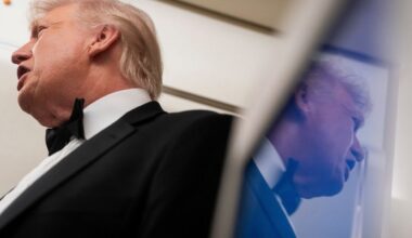 U.S. President Donald Trump is reflected in a television screen while speaking with members of the media on board Air Force One en route to Palm Beach, Florida, U.S., January 31, 2026. (Reuters/Nathan Howard)