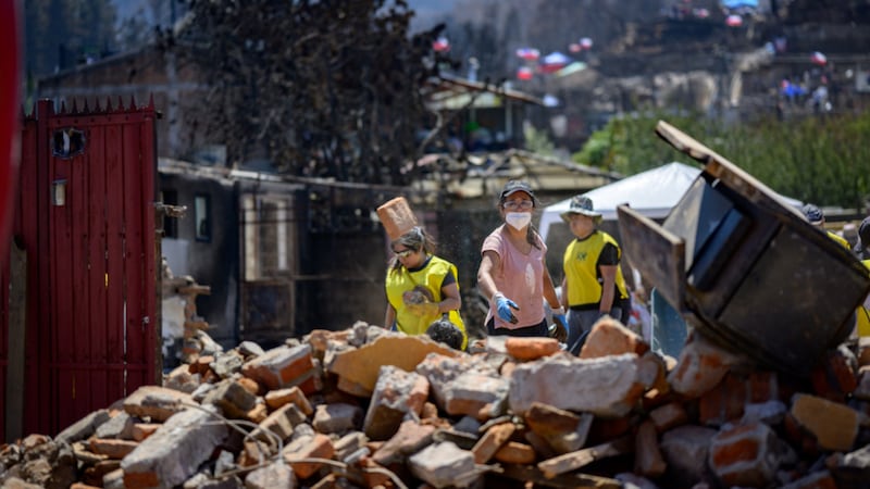 Volunteers from The Church of Jesus Christ of Latter-day Saints work to help clean-up after wildfires in the Biobío Region, southern Chile, on Saturday, Jan. 24, 2026.