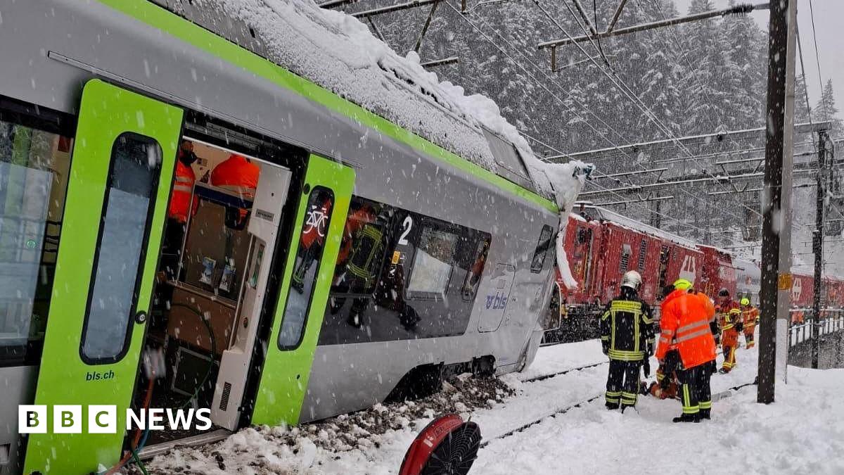 A Swiss BLS train is covered in snow following a derailment on the line linking Goppenstein to Hohtenn which injured at least five people, according to police.