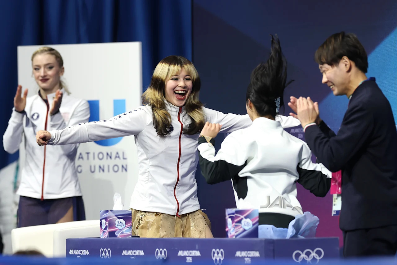 MILAN, ITALY - FEBRUARY 19: Gold medalist Alysa Liu of Team United States celebrates with bronze medalist Ami Nakai of Team Japan after competing in the Women's Single Skating - Free Skating on day thirteen of the Milano Cortina 2026 Winter Olympic games at Milano Ice Skating Arena on February 19, 2026 in Milan, Italy. (Photo by Jamie Squire/Getty Images)